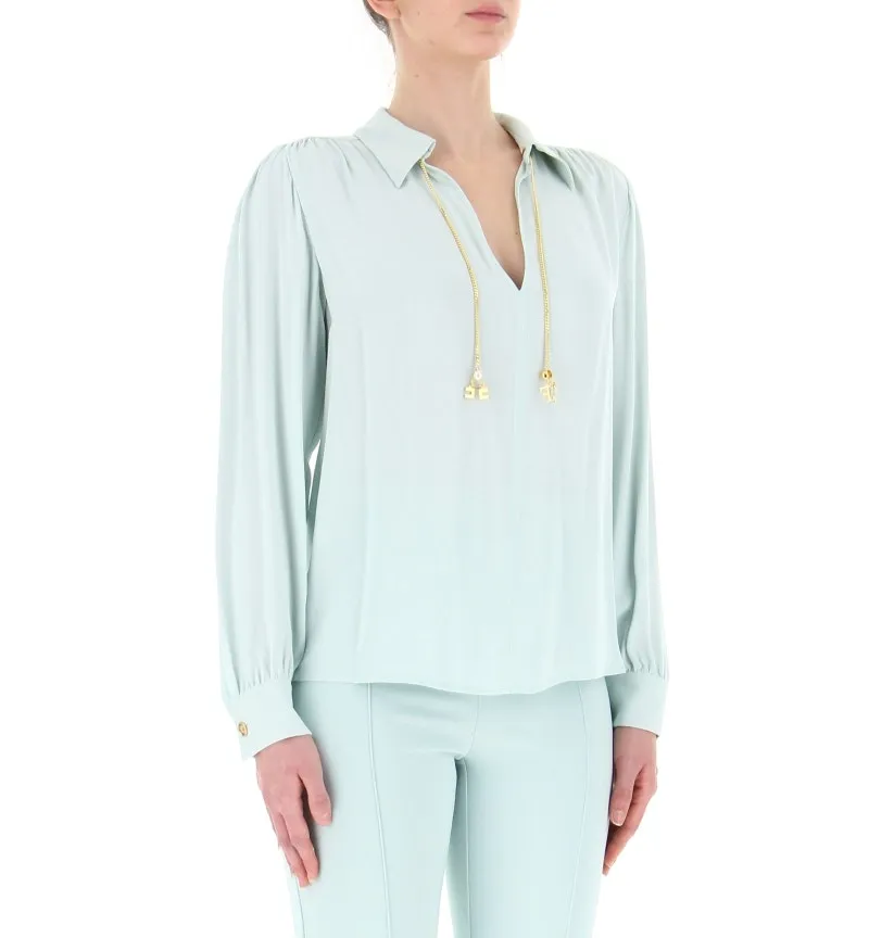 Blusa con accessorio