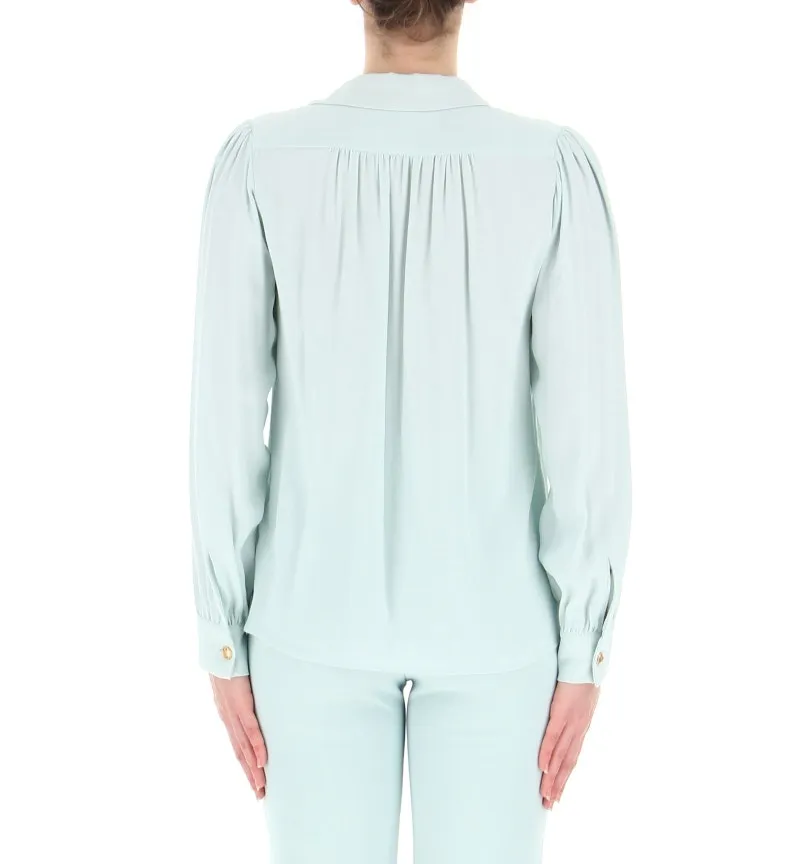 Blusa con accessorio