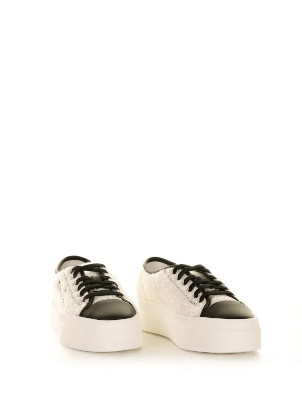 Fur sneakers with contrasting logo