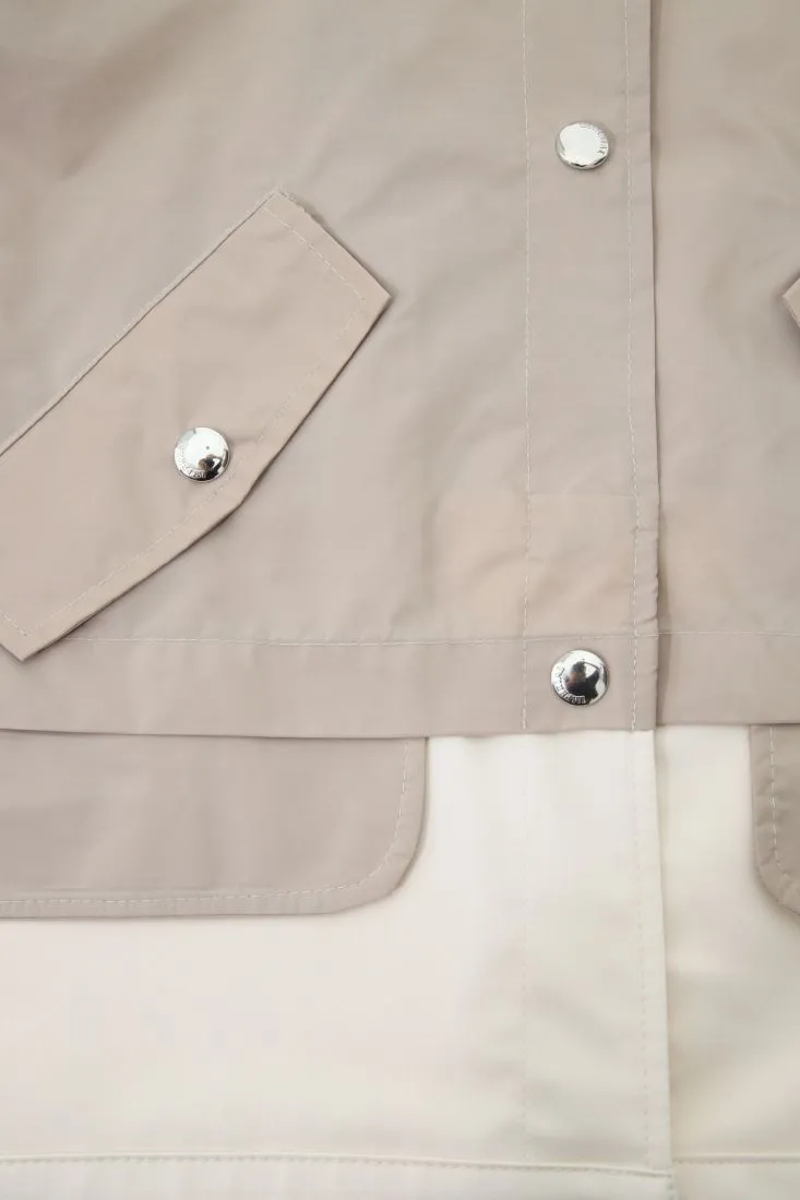 Giubbotto oversize con bottoni e parte inferiore a contrasto