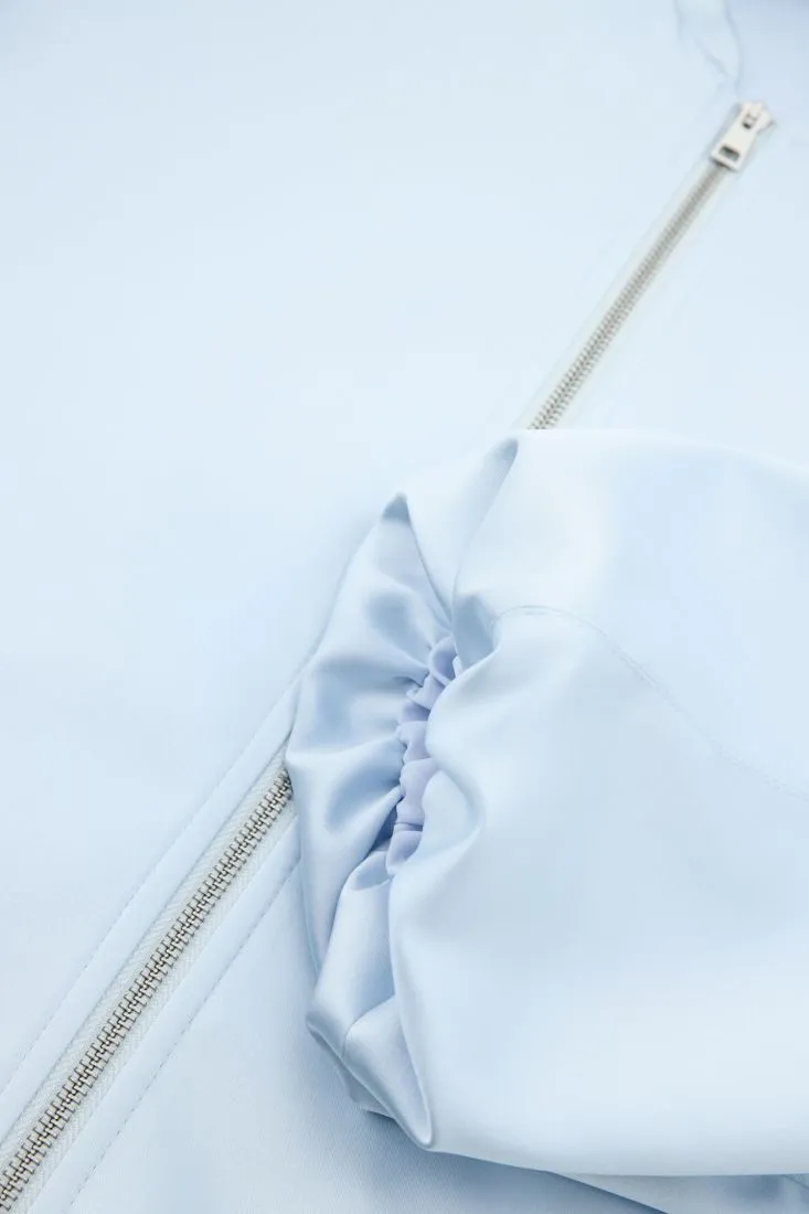 Giubbotto oversize con taschini a filetto e zip